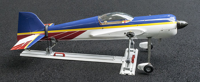RC airplane secured (tied down) for transport in a truck, trailer, or SUV.