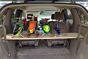 Four RC helicopters mounted on platform in Minivan for transport