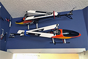 RC Helicopters mounted horizontally on wall using Skid Clamps