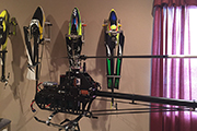 Four RC Helicopters mounted on wall using Random Heli Skid Clamps