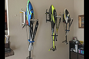RC Helicopters hanging on wall with Random Heli Skid Clamps