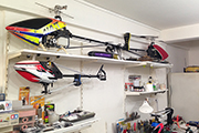 RC heli mounted to underside of adjustable shelving using Skid Clamps