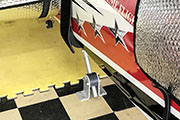 Gear Jack Tail Support is mounted to floor of RC airplane trailer.