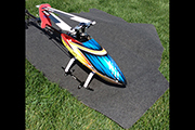 Trex 550 RC Heli mounted on carpet covered board in BMW trunk
