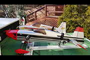 Large Radio Controlled airplanes are transported on a slide-out platform and secured with Random Heli Gear Jacks.