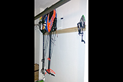 Align Trex and Mikado Logo RC Helicopters stored on garage wall using Skid Clamps