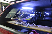 Synergy RC helicopters mounted on platform in Pickup truck using Random Heli Skid Clamps