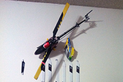 RC helicopters mounted on wall using landing skid clip clamp