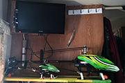 Two RC Helicopters secured to shelf in RV using Skid Clamps